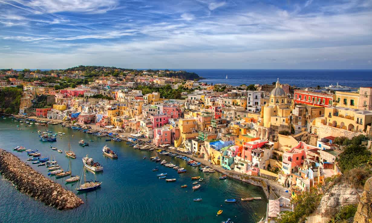 Italian coast with harbor and buildings on a cliff