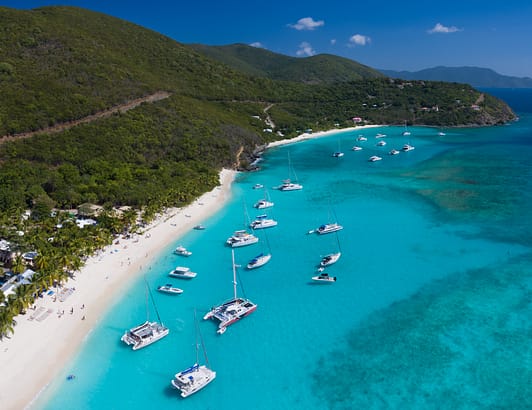 British Virgin Islands Coastline with yacht and bright blue water