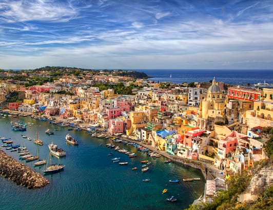 Italian coast with harbor and buildings on a cliff
