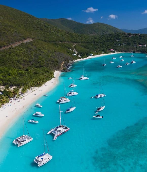 British Virgin Islands Coastline with yacht and bright blue water