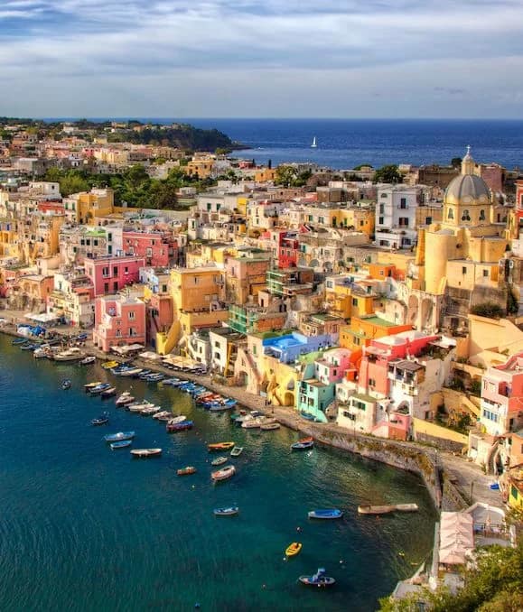 Italian coast with harbor and buildings on a cliff